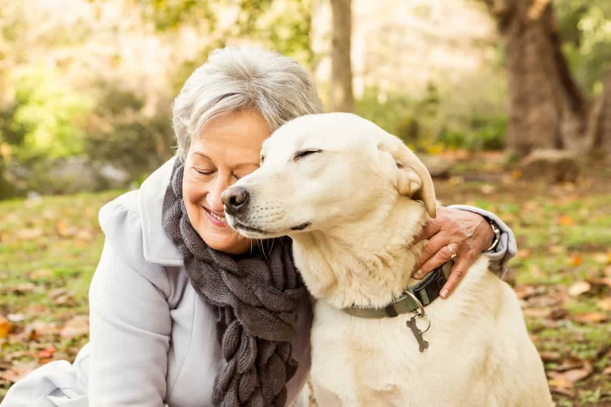 Baxter Senior Living | Senior Woman In The Park With Her Dog