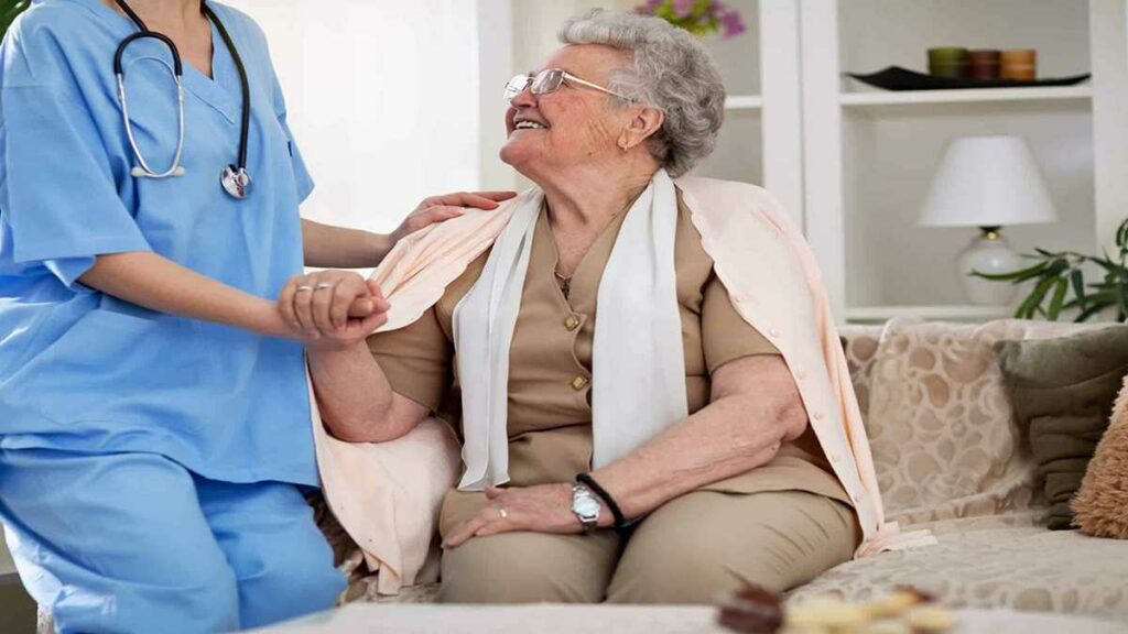 Baxter Senior Living | Elderly Woman Being Cared For By Nurse