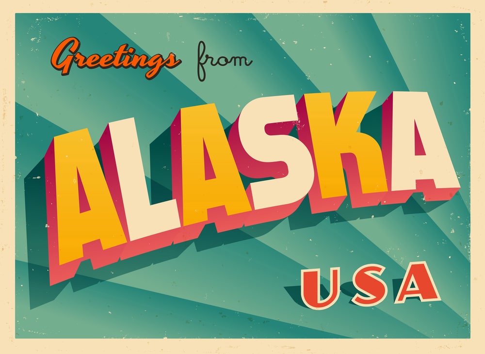 Postcard saying Greetings from Alaska: Retirement in Alaska: Exploring Ideal Locations for Your Golden Years