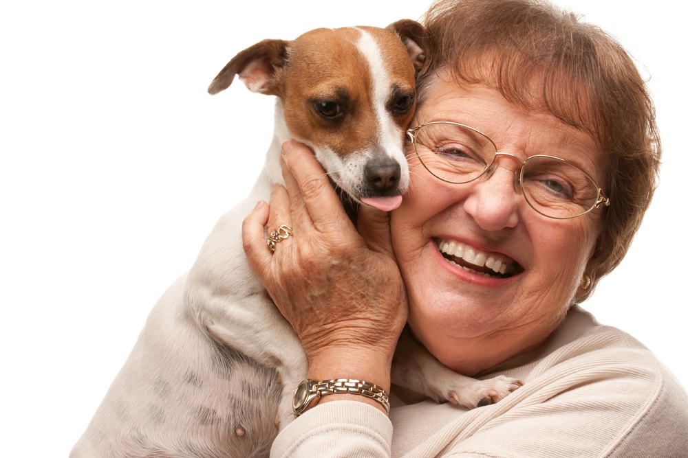 Senior woman with puppy