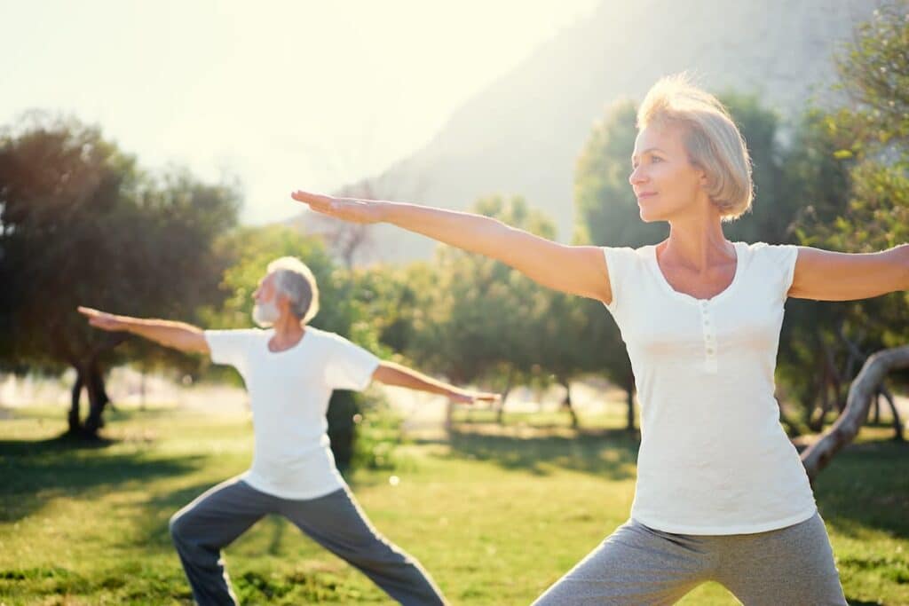 Baxter Senior Living | Senior Doing Yoga In The Park